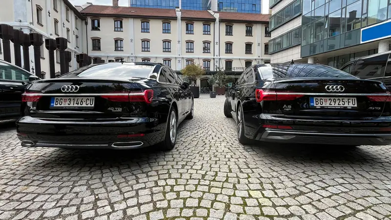 Two black Passenger Transfers Audi A6s