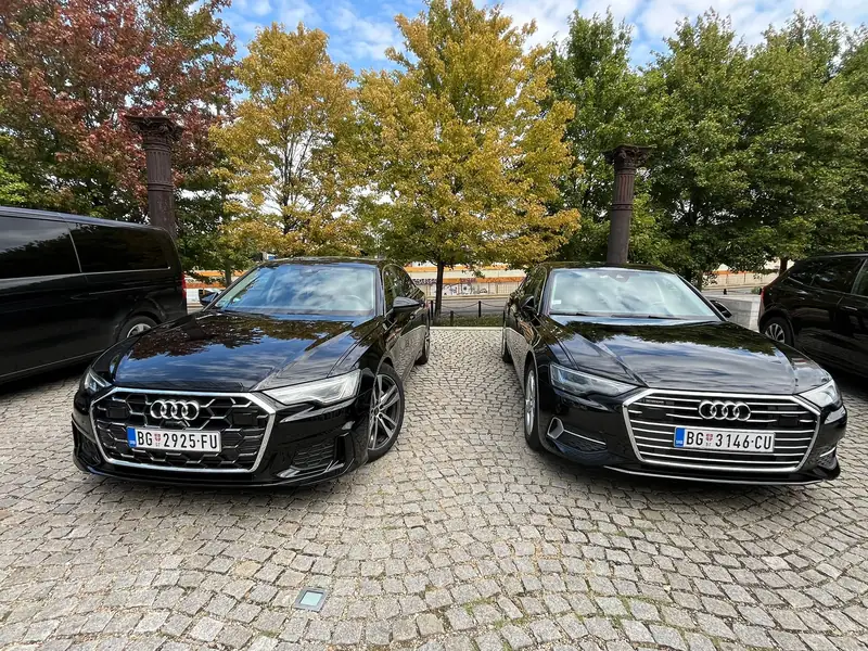 Two black Passenger Transfers Audi A6s