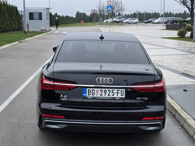 Black Passenger Transfers Audi A6, rear view